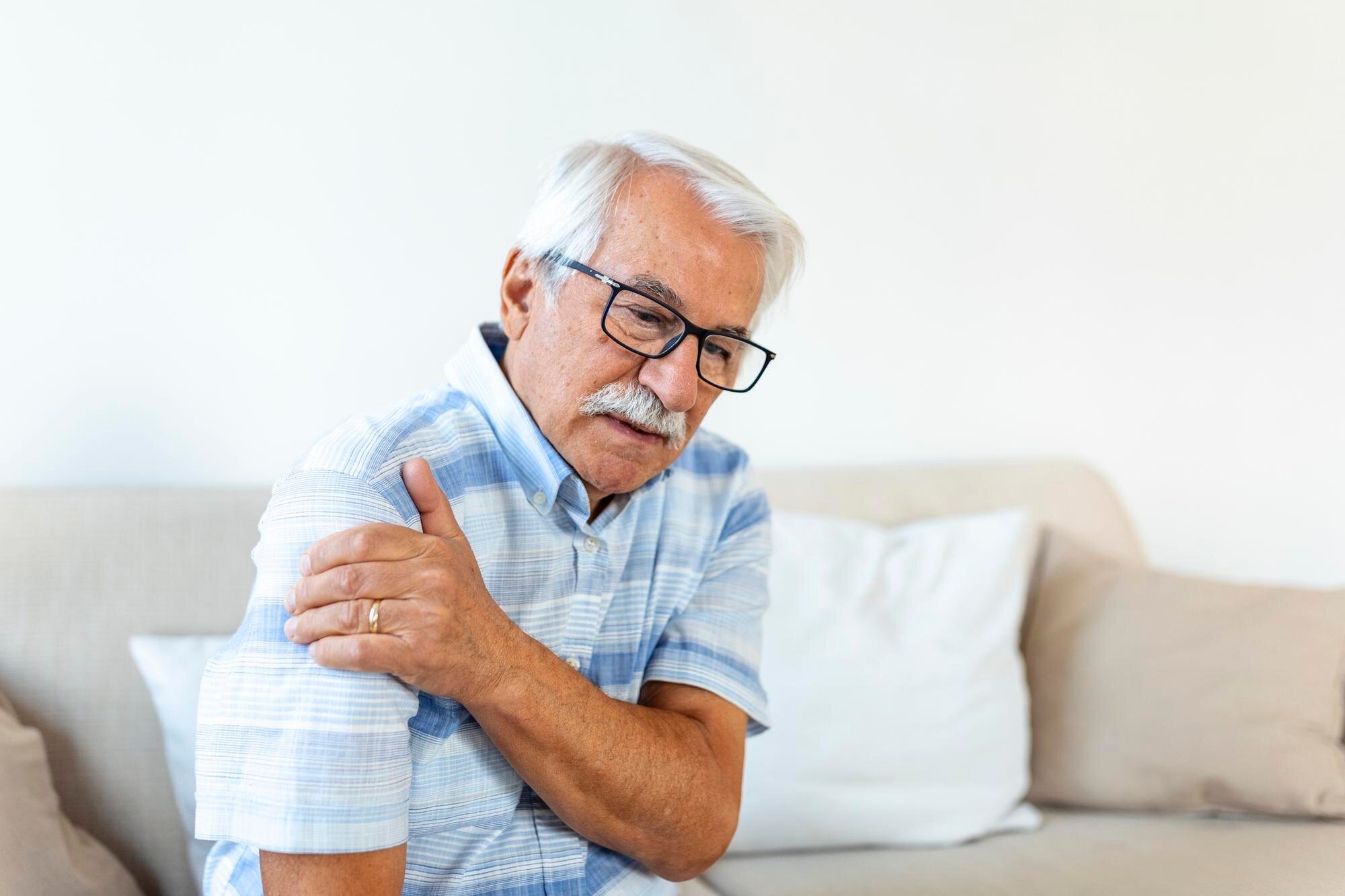senior man with shoulder pain