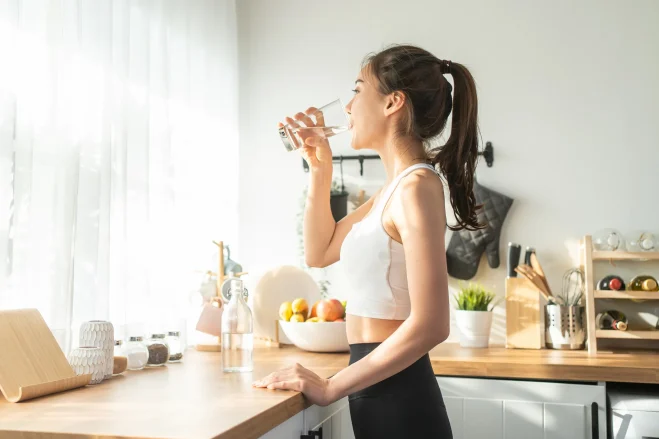 Woman drinking hydrogen-enriched water for health benefits