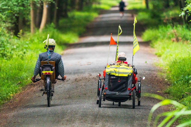 Active seniors cycling in forest - hydrogen therapy for recovery and energy